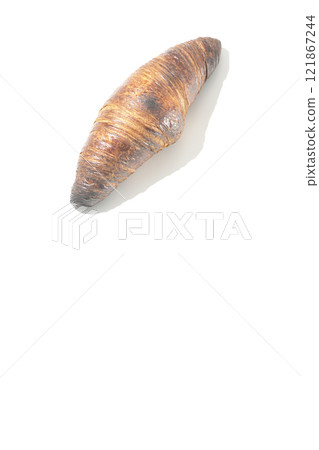 A slightly burnt black wasan photographed against a white background 121867244