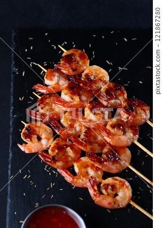Grilled tiger shrimp kebab with sauce. Appetizer for beer.Flat lay. Top view. 121867280
