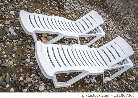 Sun beds on the beach 121867365