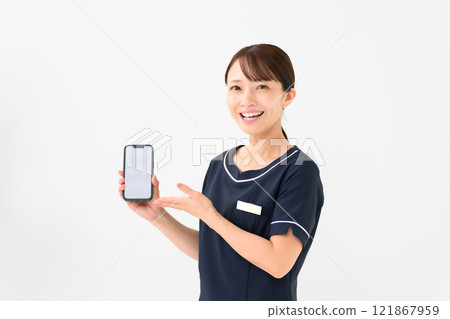 Esthetician, uniform, smartphone Esthetician, uniform, smartphone 121867959