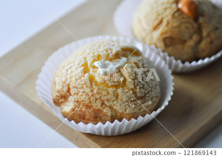 choux cream or cream puff, eclair or custard choux cream 121869143