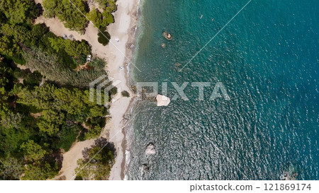 Aerial View of Forested Coastline and Clear Blue Sea Aerial View of Forested Coastline and Clear Blue Sea 121869174