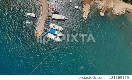 Top-Down Aerial of Boats in Clear Blue Harbor 121869179