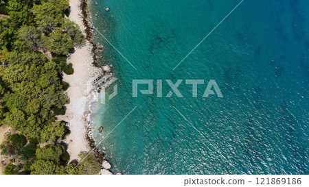Aerial View of Rocky Beach and Clear Turquoise Sea 121869186