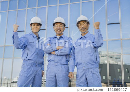 Three smiling workers looking at the camera Building maintenance staff image 121869427