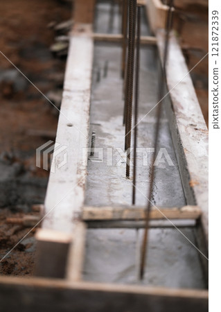 Construction of pile-grillage foundation. Monolithic foundation with metal reinforcement. Monolithic concrete foundation. House construction Construction of pile-grillage foundation. Monolithic foundation with metal reinforcement. Monolithic concrete foundation. House construction 121872339