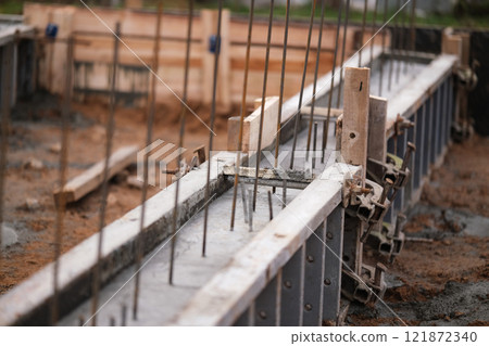 Construction of pile-grillage foundation. Monolithic foundation with metal reinforcement. Monolithic concrete foundation. House construction Construction of pile-grillage foundation. Monolithic foundation with metal reinforcement. Monolithic concrete foundation. House construction 121872340