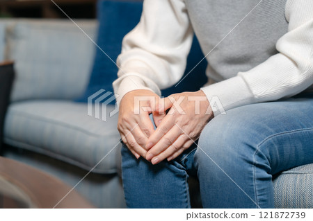 Knee pain, senior woman, hand 121872739
