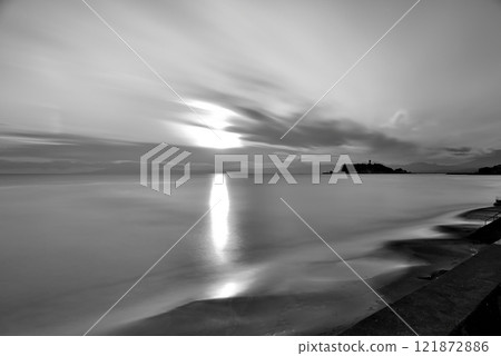 Evening view of Enoshima from Shichirigahama Beach, iridescent clouds, long exposure, background material, monochrome Evening view of Enoshima from Shichirigahama Beach, iridescent clouds, long exposure, background material, monochrome 121872886