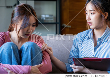 A psychiatrist counseling her patient A psychiatrist counseling her patient 121874018