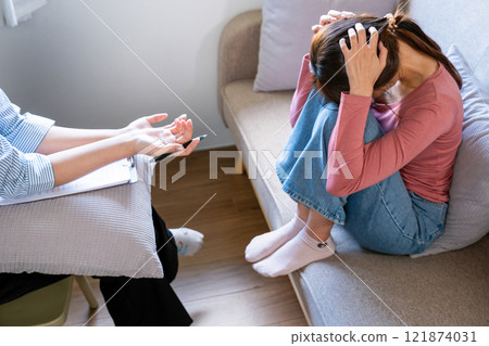 A psychiatrist counseling and consulting her patient 121874031