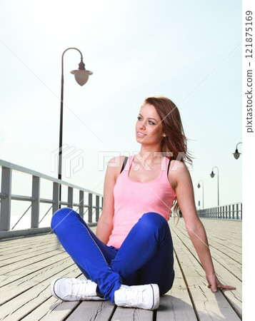 Attractive girl Young woman pier sea 121875169