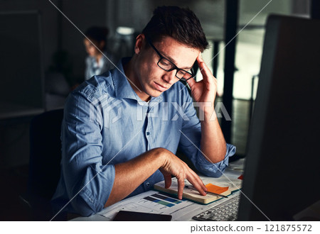 Tired, overworked and exhausted business man feeling stress, anxiety and pressure while suffering with a headache or migraine and working late. Male employee doing overtime to meet a work deadline 121875572