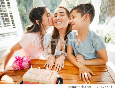 Birthday party, mothers day or festive celebration with mother and kids celebrating mom with a cake and festive, fun decoration. Loving and affectionate children kissing mother showing love and joy 121875581