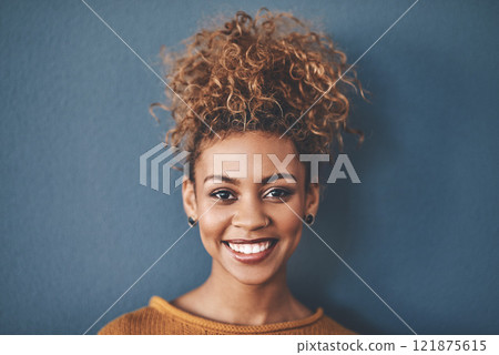 Face of a happy, confident and beautiful black woman with a positive mindset a bright smile. Portrait of a carefree, pretty and attractive African American female, isolated on a studio background 121875615