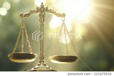 set of scales of justice illuminated by sunlight, symbolizing fairness and balance in law. golden scales stand prominently, reflecting importance of justice 121875818