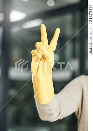 Peace sign, carefree, and hand gesture while cleaning, doing chores and housework alone at home. Closeup of fingers of a cleaner counting, expressing happiness and enjoying a hygiene task Peace sign, carefree, and hand gesture while cleaning, doing chores and housework alone at home. Closeup of fingers of a cleaner counting, expressing happiness and enjoying a hygiene task 121875885