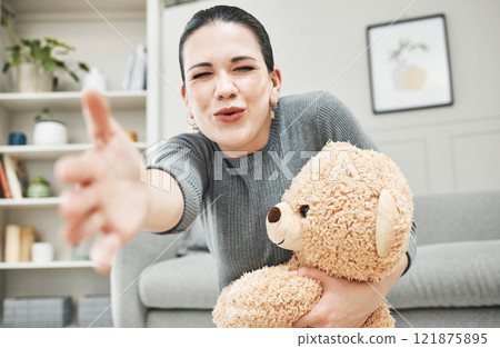 Social worker, therapist or psychologist with teddybear for support, child wellness and development in therapy or children center. Elderly lady or Grandmother with loving and fun gift or toy for kid. 121875895