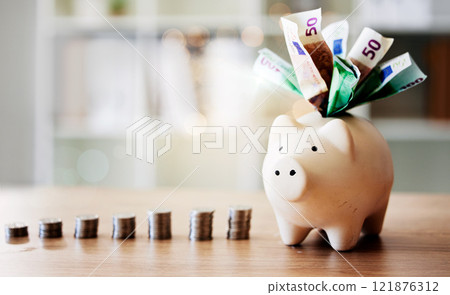 Banking, finance and investment in piggybank for future savings, budget and insurance on a table. Closeup of tool to save with cash notes and coins from investing for the future and financial growth 121876312