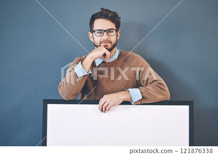 Young man standing behind an empty sign with copyspace. Smiling, attractive and smart male holding a blank board announcement for marketing. Handsome guy with a poster for an advert, banner or news. Young man standing behind an empty sign with copyspace. Smiling, attractive and smart male holding a blank board announcement for marketing. Handsome guy with a poster for an advert, banner or news. 121876338
