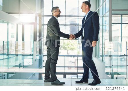 Confident, smiling corporate businessmen exchange handshake in global trust merger meeting together at modern company. Professional executive colleagues in company trade development deal conference Confident, smiling corporate businessmen exchange handshake in global trust merger meeting together at modern company. Professional executive colleagues in company trade development deal conference 121876341