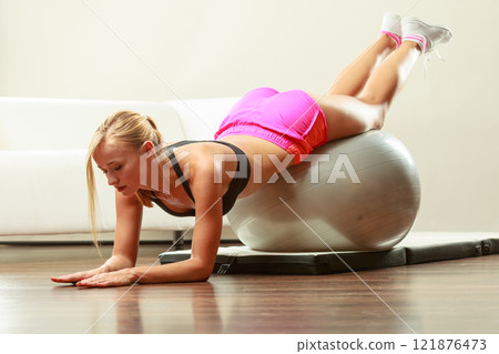 woman doing fitness exercises with fit ball woman doing fitness exercises with fit ball 121876473