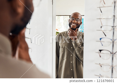 Customer trying on glasses at an optometrist, smiling and looking confident with choice at optical store . Carefree man buying trendy spectacles to help with vision. Excited male satisfied with frame 121876601