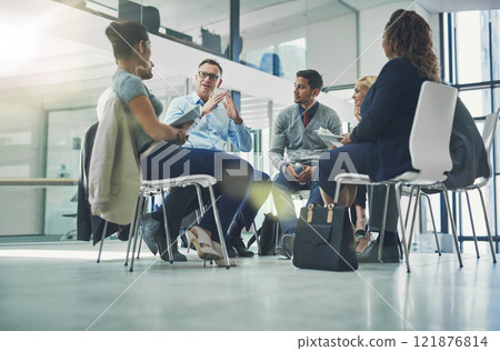Teamwork, collaboration and strategy planning of business team working together indoors. Modern office workers talking and sitting in a group meeting. Colleagues work and talk about a project Teamwork, collaboration and strategy planning of business team working together indoors. Modern office workers talking and sitting in a group meeting. Colleagues work and talk about a project 121876814