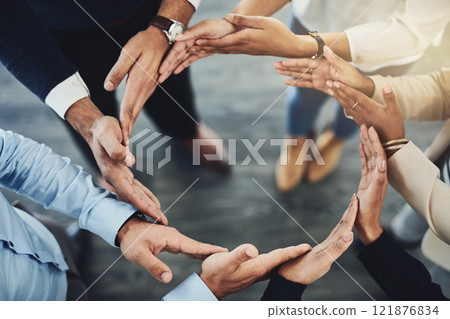 Circle of hands, teamwork and togetherness with a group of business colleagues standing in a team huddle from above. Working together, showing unity and giving support in a meeting for motivation Circle of hands, teamwork and togetherness with a group of business colleagues standing in a team huddle from above. Working together, showing unity and giving support in a meeting for motivation 121876834