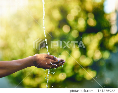 Closeup of hands catching fresh water outdoors, having fun in nature and practicing good hygiene. Person washing their fingers in a clean stream, enjoying splashing and refreshing germ free hydration Closeup of hands catching fresh water outdoors, having fun in nature and practicing good hygiene. Person washing their fingers in a clean stream, enjoying splashing and refreshing germ free hydration 121876922