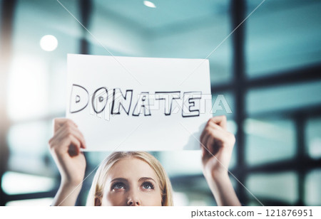 Donate, volunteer and give back to the community with a sign in the hands of a young woman inside. Closeup of a poster with text looking for welfare aid, donations and contributions to society Donate, volunteer and give back to the community with a sign in the hands of a young woman inside. Closeup of a poster with text looking for welfare aid, donations and contributions to society 121876951