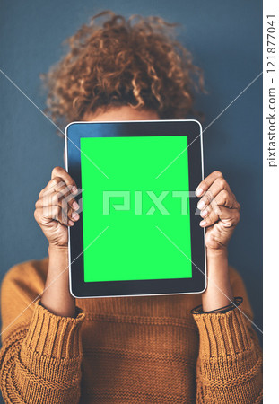 Green screen, copy space and chromakey on a tablet of a woman showing website for online advertising. Closeup of female with blank touch screen, branding for a business logo or news and marketing Green screen, copy space and chromakey on a tablet of a woman showing website for online advertising. Closeup of female with blank touch screen, branding for a business logo or news and marketing 121877041