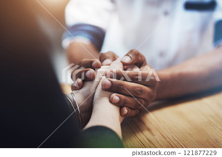 Interracial couple holding hands in support, comfort and trust while bonding and feeling united in home living room. Closeup of man touching, comforting or caring for woman who has anxiety in therapy Interracial couple holding hands in support, comfort and trust while bonding and feeling united in home living room. Closeup of man touching, comforting or caring for woman who has anxiety in therapy 121877229