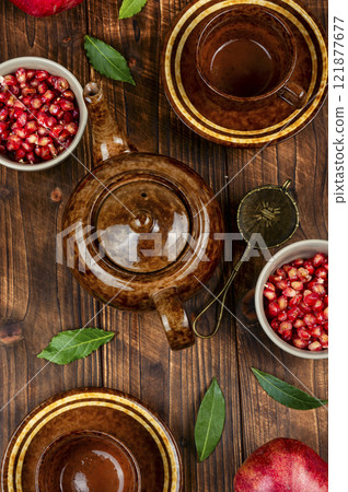 Tea with fresh pomegranate. 121877677