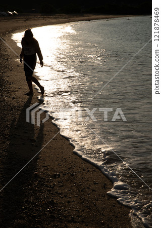 A girl playing at the beach A girl playing at the beach 121878469