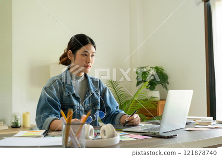 Young female architect envisions project with technology. Young female architect envisions project with technology. 121878740