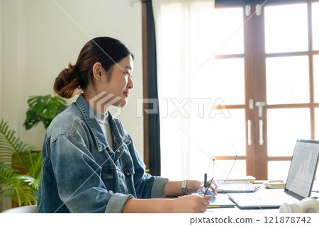 Young female architect envisions project with technology. 121878742