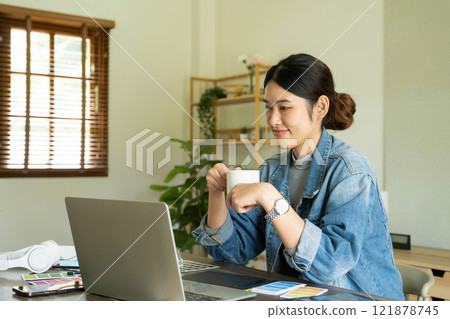 Young female architect taking a break from work. Young female architect taking a break from work. 121878745