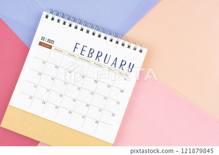 February 2025 month desk calendar on colorful background. February 2025 month desk calendar on colorful background. 121879845