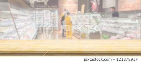 Wood table top with supermarket grocery store blurred background with bokeh light for product display 121879917