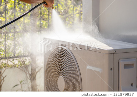 air conditioning compressor outdoor unit cleaning service with water spray 121879937