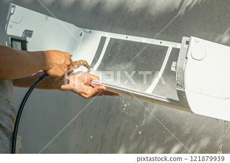 air conditioning cleaning service with water spray 121879939