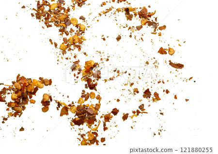 dried red chili pepper flakes and seeds isolated on white background dried red chili pepper flakes and seeds isolated on white background 121880255