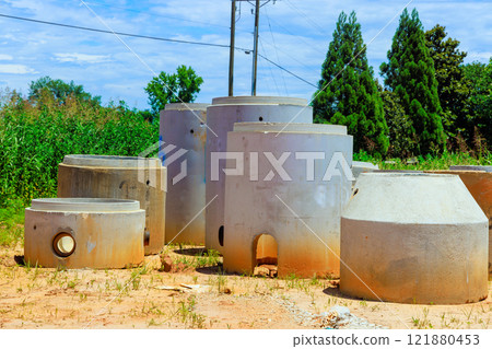 Concrete pipes forms for sewer systems materials at construction site ready for installation. Concrete pipes forms for sewer systems materials at construction site ready for installation. 121880453