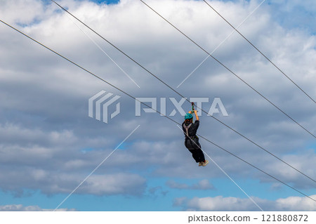 White sand beach, blue sea and sky. Zip line over the sea at Sheraton Okinawa Sunmarina Resort. White sand beach, blue sea and sky. Zip line over the sea at Sheraton Okinawa Sunmarina Resort. 121880872