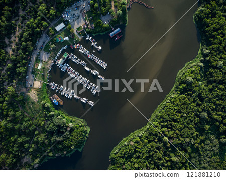 Bird's-eye view of luxury yachts and speedboats in the marina and yacht club. Bird's-eye view of moored sailboats. Bird's-eye view of luxury yachts and speedboats in the marina and yacht club. Bird's-eye view of moored sailboats. 121881210