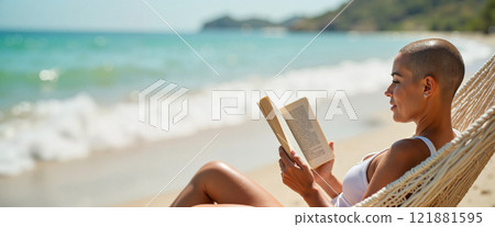Relaxing on the beach while reading a book under the warm sun with soft waves gently lapping at the shore 121881595