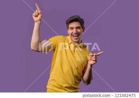 Active positive man dancing on violet background. Funny dance, great mood vibes Active positive man dancing on violet background. Funny dance, great mood vibes 121882475