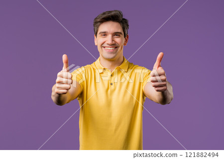Positive smiling man with hand sign like, thumb up gesture. Happy guy on violet Positive smiling man with hand sign like, thumb up gesture. Happy guy on violet 121882494