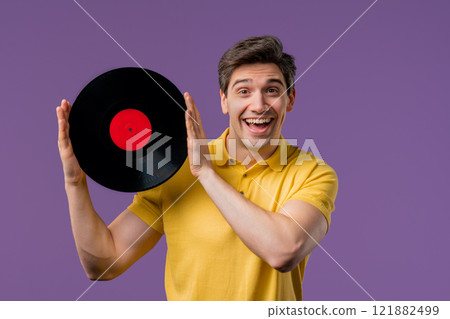 Handsome Man Dancing Vinyl Record Disc On Violet. Hobby, Music Lover, Collection 121882499